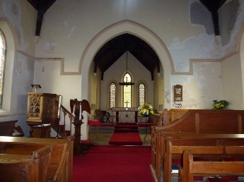 The aisle and altar in Matfen Church.