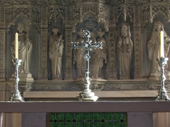 Bamburgh Church - altar, cross and carvings.