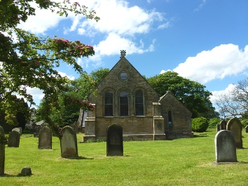 A view of Ulgham Church across the graveyard.